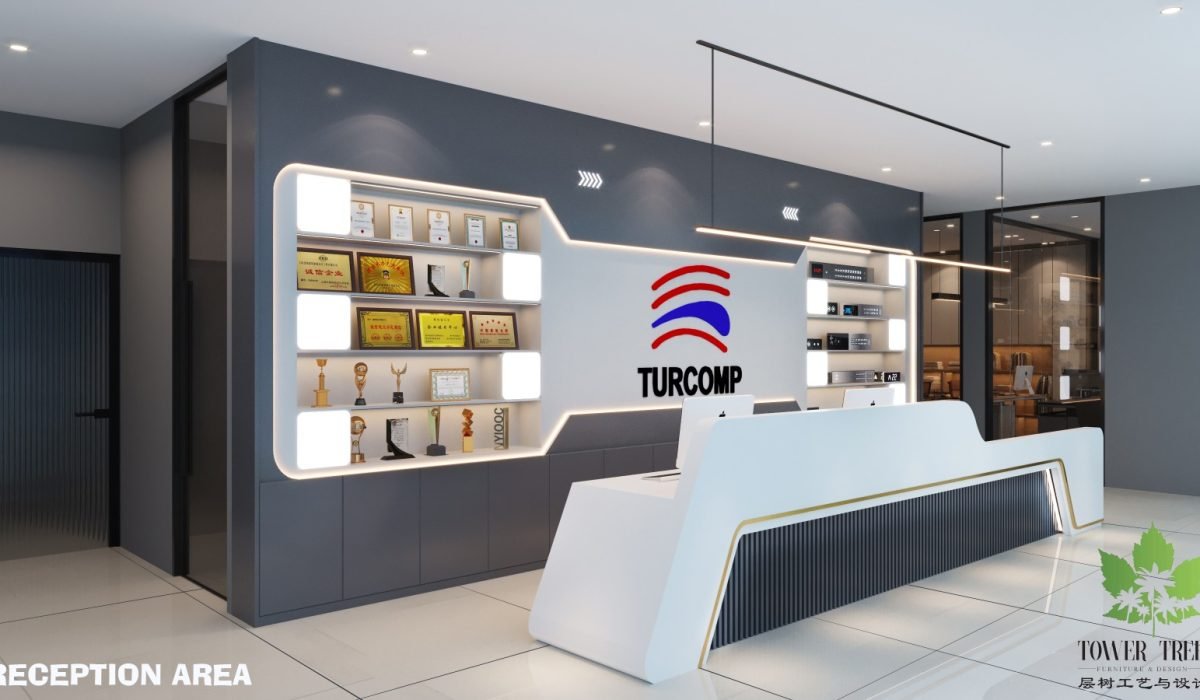 Modern corporate office reception area interior design with a custom white counter and branded trophy feature wall in Johor.